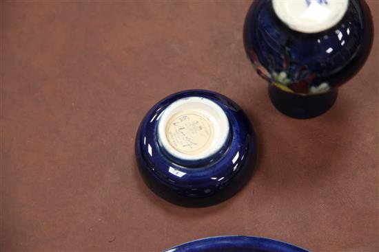 A Moorcroft pomegranate pattern dish, a tiger lily pattern small vase and a hibiscus pattern dish, 8cm - 20.5cm